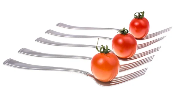 Conceito de alimentação saudável. Tomates de cereja em garfos — Fotografia de Stock