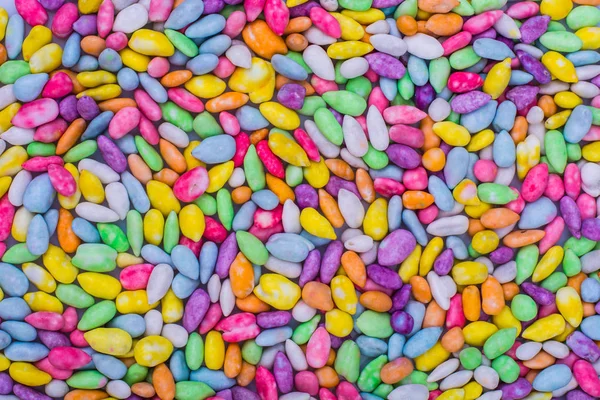 Background, texture of multi-colored small sweet dragees