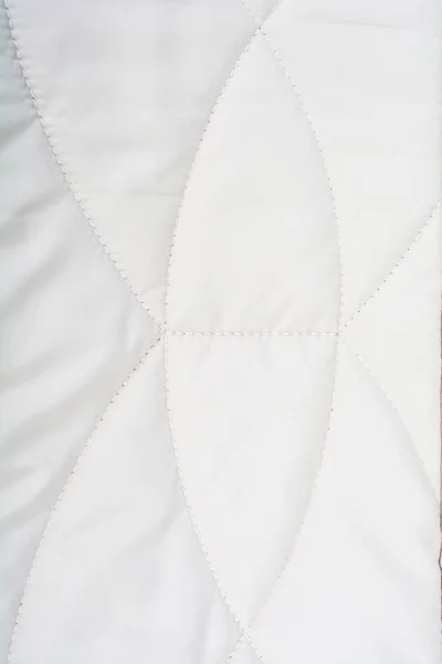 Textura de tecido acolchoado luz close-up — Fotografia de Stock