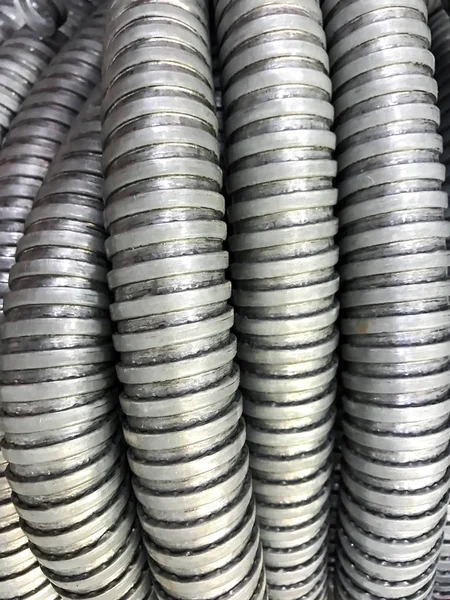 Background of gray corrugated metal tubes — Stock Photo, Image