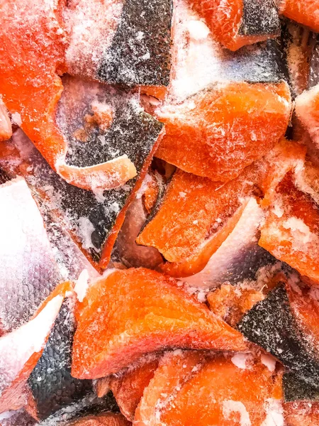 Fillet pieces of frozen salmon