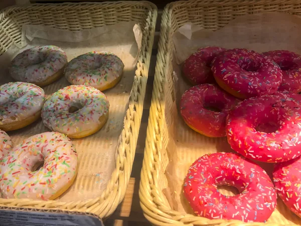 Boxes with donuts on shelves of bread shop, Hanukkah celebration