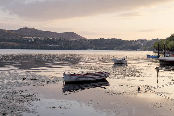 Boats against the backdrop of the city in the evening 