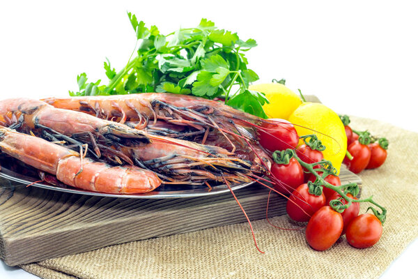 Shrimps and vegetables on a white background