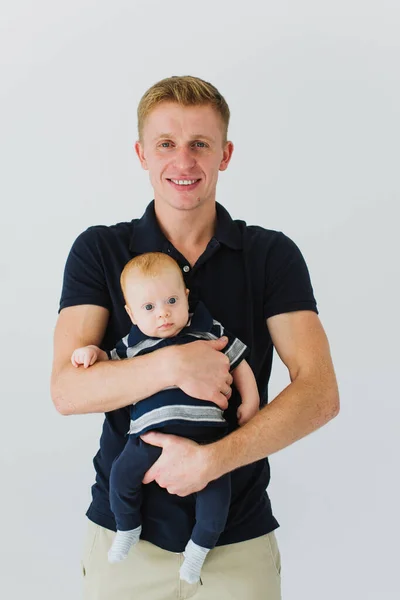 Dad Holds Baby His Arms Smiles While Looking Camera — Stock Photo, Image