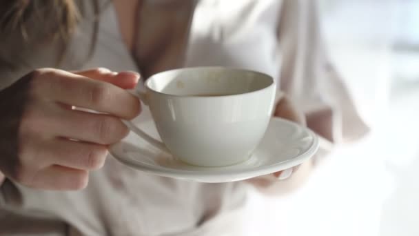Close up of womans hands holding white saucer and drinking 4K — Stock Video