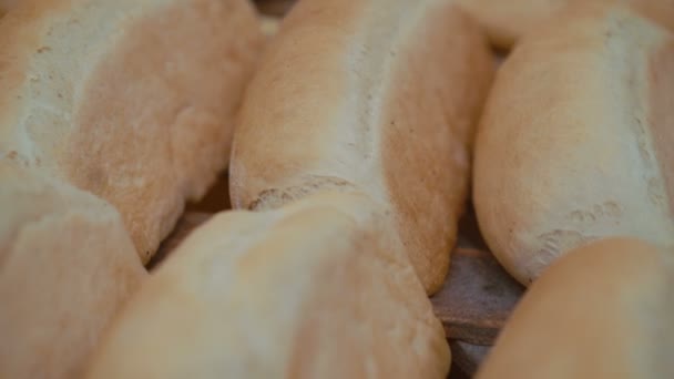 Close up of many fresh loafs of wheat bread 4K — Stock Video