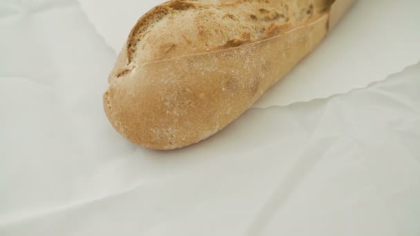 Close up of wheat bread on the white background in 4K — Stock Video