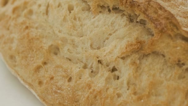 Close up of wheat bread on the white background — Stock Video