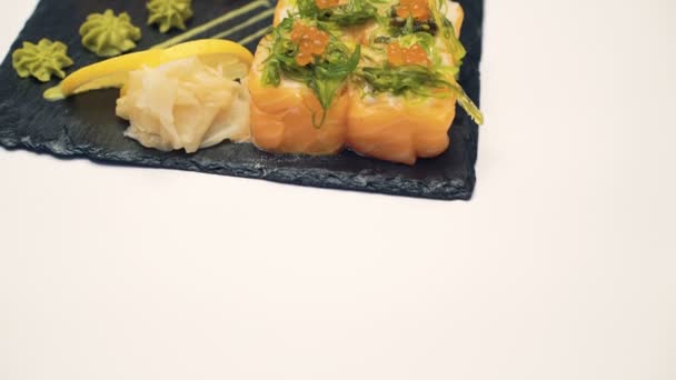 Sushi danie na białym tle 4k — Wideo stockowe