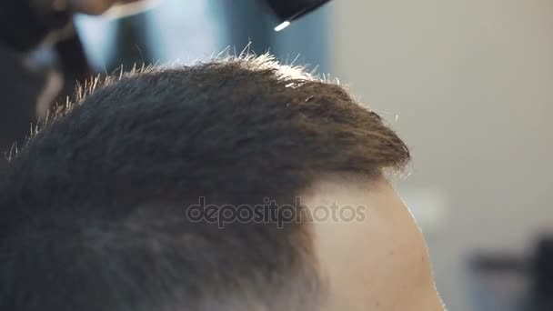 Haircutter drying male hair in 4K — Stock Video