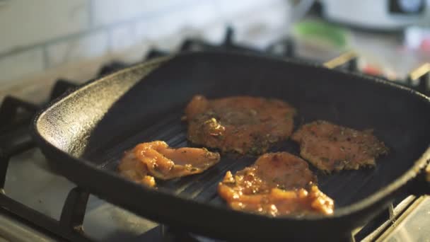 Close up of frying meat on grill and pouring sauce in 4K — Stock Video