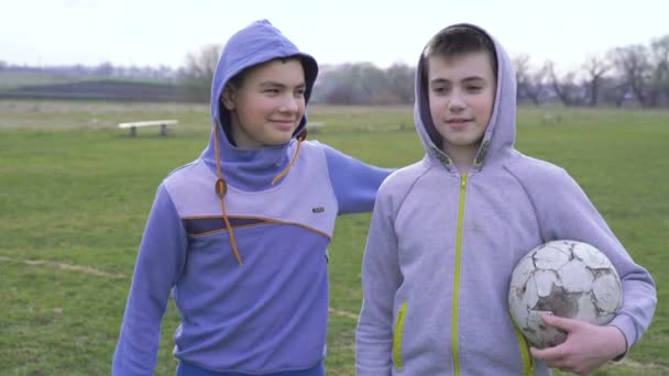 Portrait of smiling boys with ball in hands on the stadium 4K — Stock Video