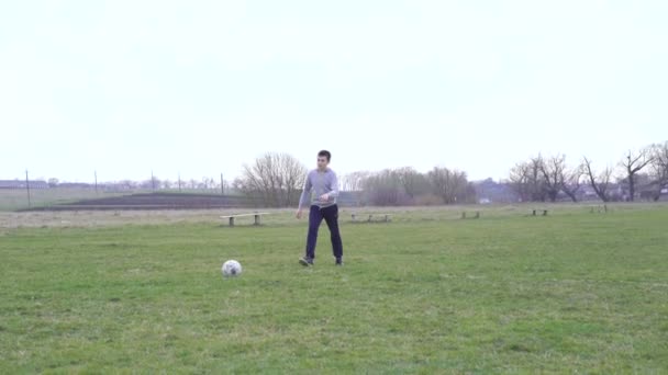 Happy boys play football on the stadium in 4K — Stock Video