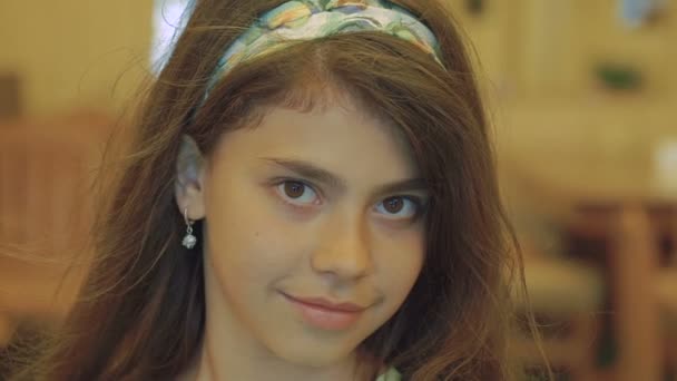 Pretty Little Brunette With Brown Eyes Looking At Camera Slowly
