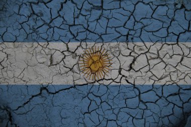 Çatlak dünyanın arka planında Arjantin bayrağı. Tasarım çözümleri kavramı.