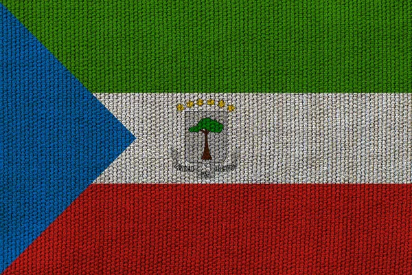 背景纹理上有赤道几内亚国旗 设计者解决方案的概念 — 图库照片