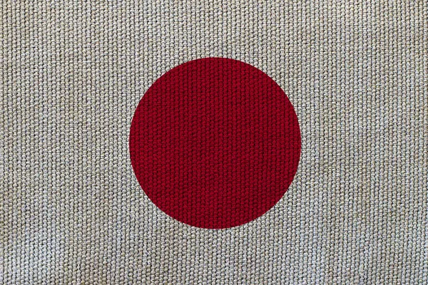 Japan flag on the background texture. Concept for designer solutions.