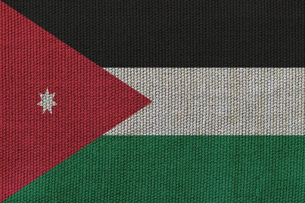 Jordan flag on the background texture. Concept for designer solutions.