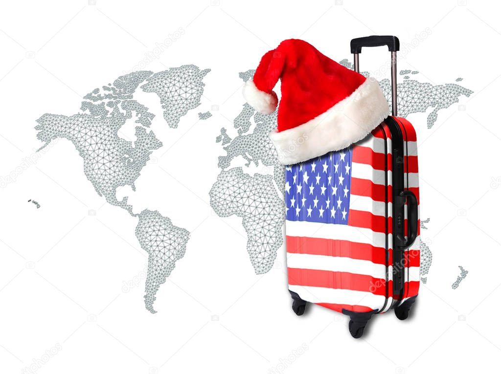A suitcase with the texture of the US flag on wheels with a cap of Santa Claus, against the background of the world.