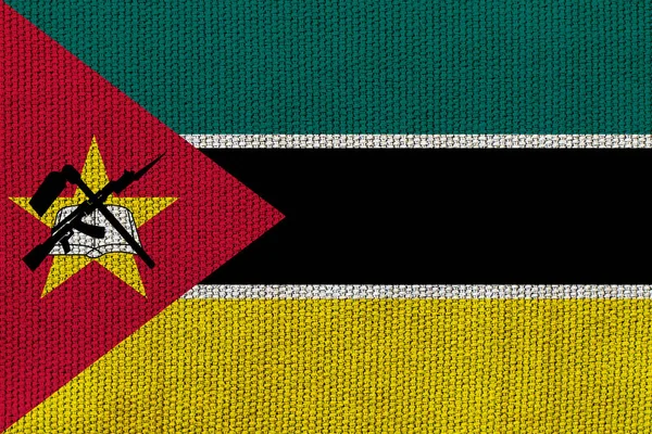 背景纹理上有莫桑比克国旗 设计者解决方案的概念 — 图库照片
