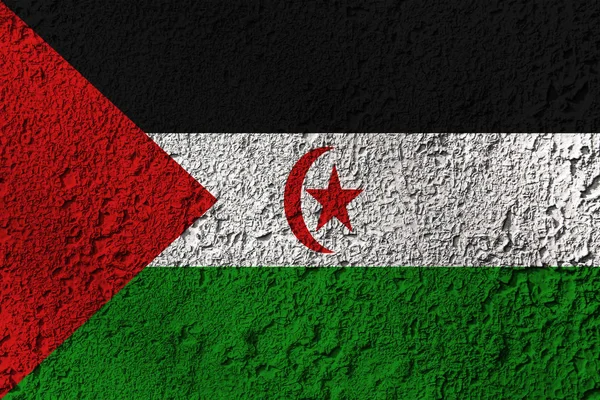 Western Sahara flag on the background texture. Concept for designer solutions.