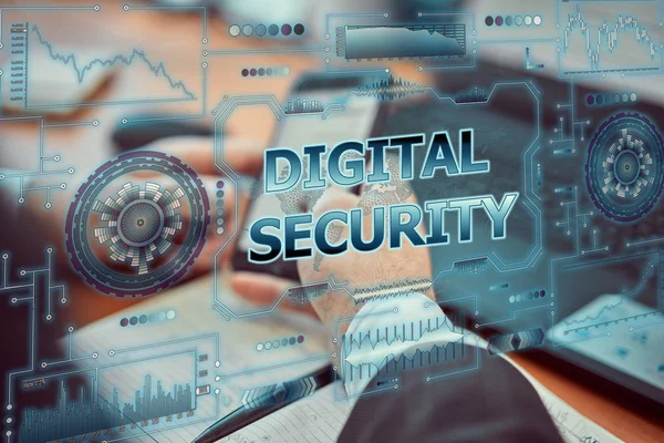 En ung affärsman använder en futuristisk laptop med den senaste holografiska augmented reality-tekniken med inskriptionen "Digital Security". — Stockfoto