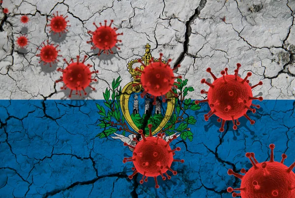 Red virus cells, pandemic influenza virus epidemic infection, coronavirus, Asian flu concept, against the background of a cracked San Marino flag