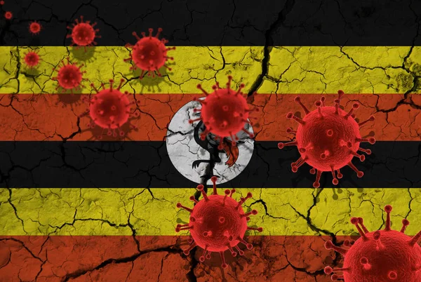 Red virus cells, pandemic influenza virus epidemic infection, coronavirus, Asian flu concept, against the background of a cracked Uganda flag