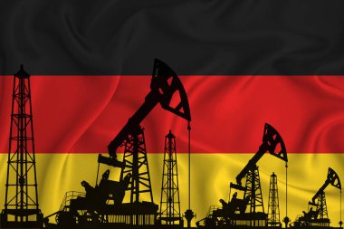 Almanya bayrağının arka planında sondaj kulesi ve petrol kuyusu silueti var. Petrol ve gaz endüstrisi. Petrol alanları ve petrol şirketleri kavramı.