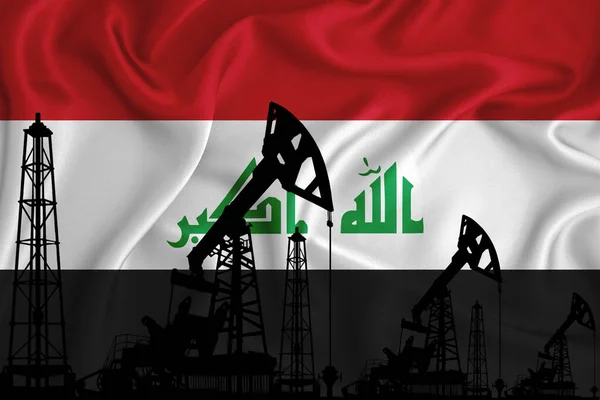 Silhouette of drilling rigs and oil derricks on the background of the flag of Iraq. Oil and gas industry. The concept of oil fields and oil companies.