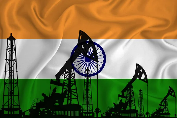 Silhouette of drilling rigs and oil derricks on the background of the flag of India. Oil and gas industry. The concept of oil fields and oil companies.