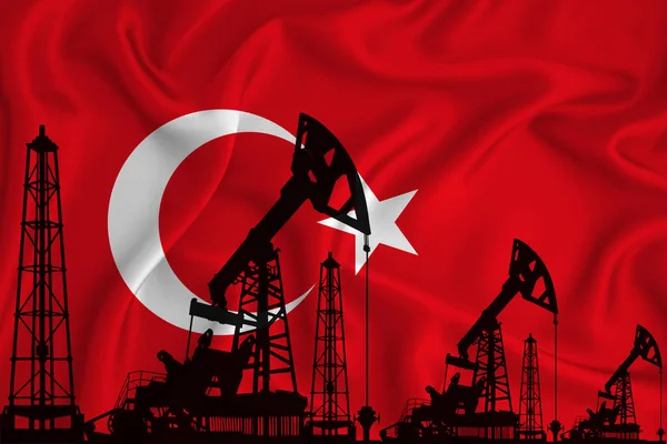 Silhouette of drilling rigs and oil derricks on the background of the flag of Turkey. Oil and gas industry. The concept of oil fields and oil companies.