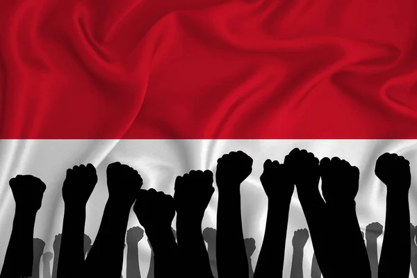 Kaldırılmış Kolların Silueti Endonezya Bayrağının Arka Planında Sıkılmış Yumruklar Güç — Stok fotoğraf