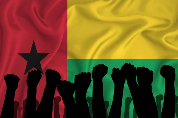 Gine Bissau Bayrağının Arka Planında Kaldırılmış Kolların Silueti Sıkılmış Yumruklar — Stok fotoğraf