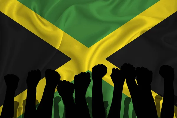在牙买加国旗的背景上 高举的胳膊和紧握拳头的轮廓 权力的概念 和你的文字的位置 3D渲染 — 图库照片