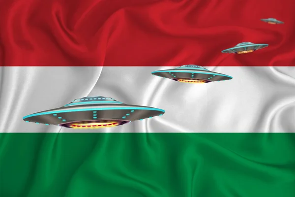 Waving flag of Hungary. UFO group on the background of the flag. UFO news concept in the country. 3D rendering