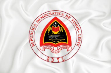 Doğu Timor armalı, gelişmekte olan beyaz bir bayrak. Ülke sembolü. İllüzyon. Orijinal ve basit arma resmi renklerde ve doğru oranlarda.