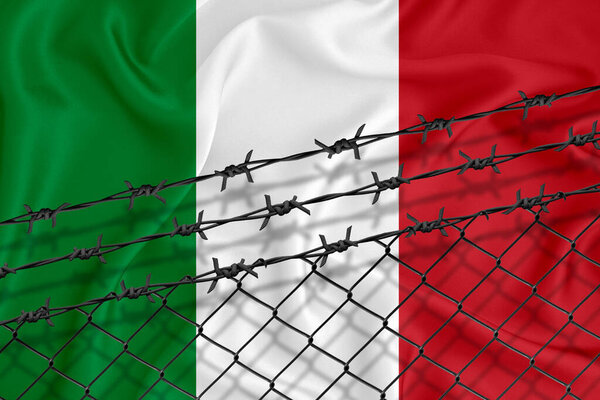 Developing Italy Flag, mesh fence and barbed wire. Concept of isolation of emigrants. With place for your text.