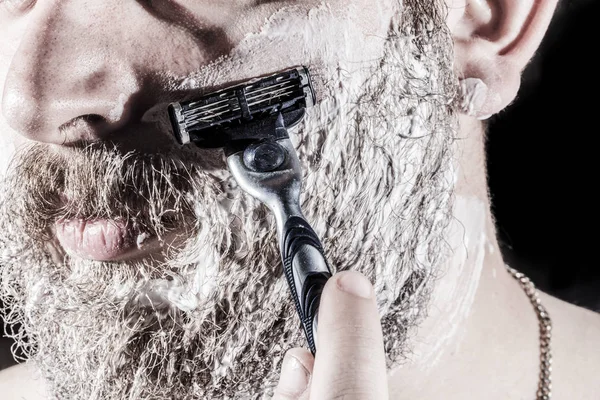 the man is shaving