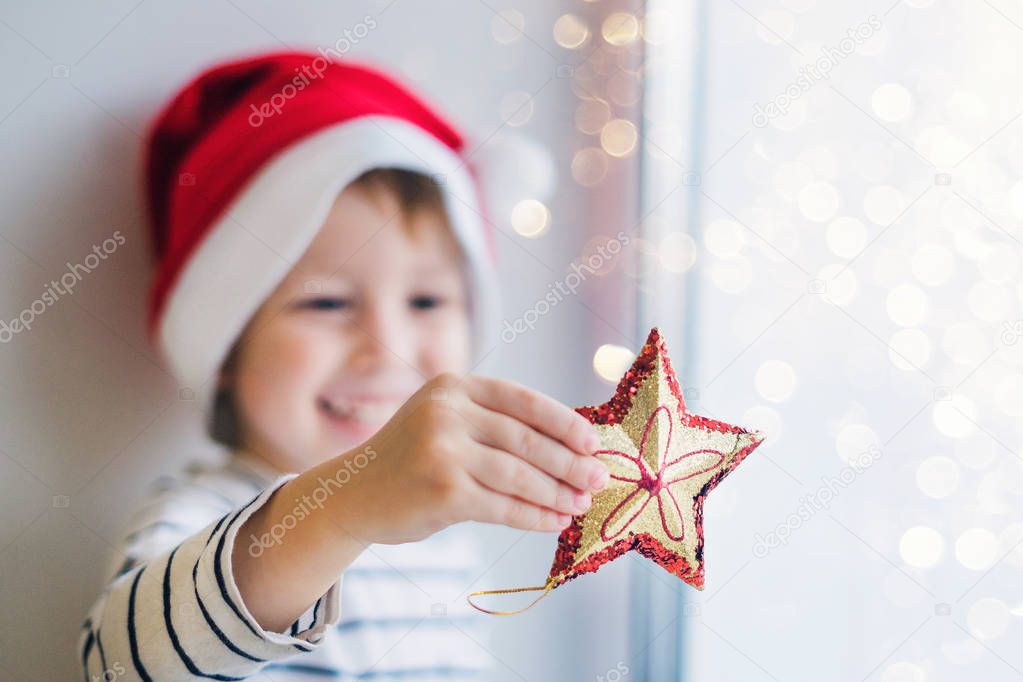 Boy holding a Christmas star