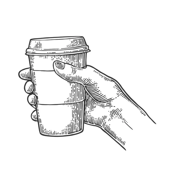 Kvinnlig hand hållande en disponibel kopp kaffe med kartong hållare och cap. — Stock vektor