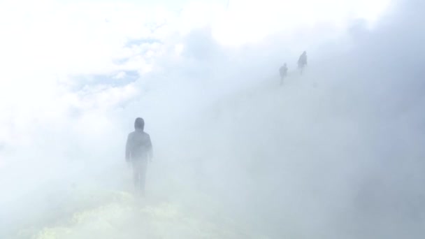 People hiking on active volcano with smoke and fumes in Kamchatka — стокове відео