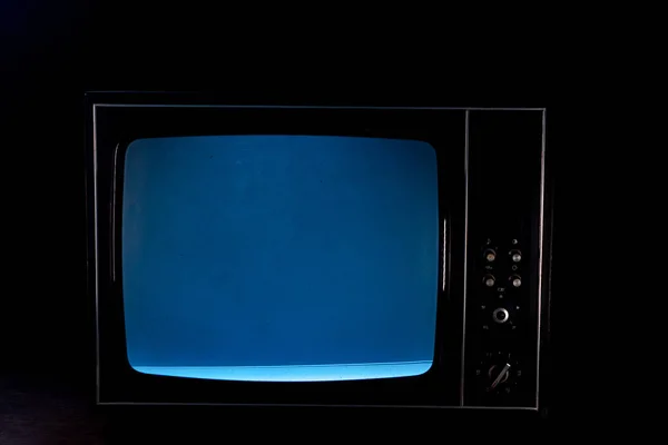 Static noise on a vintage TV set in black background — Stock Photo, Image