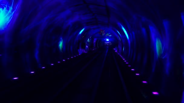 Shuttle trains in Bund Sightseeing Tunnel. Metro subway train in city. Tunnel of lights under Huangpu River is one of Shanghais top five tourist attraction — Stock Video