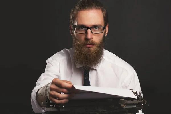 Handsome young hipster businessman thinking and writing with vin — Stock Photo, Image