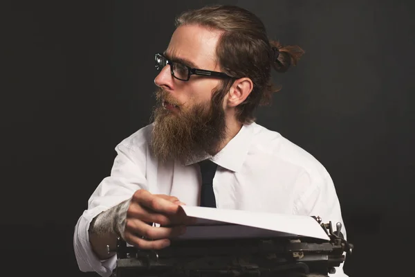 Handsome young hipster businessman thinking and writing with vin — Stock Photo, Image