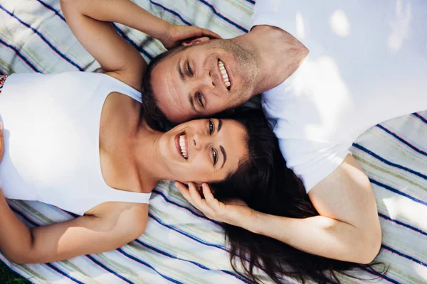 Beautiful horizontal top view of a attractive couple in love lyi — Stock Photo, Image