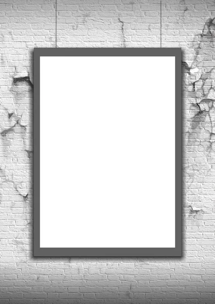 White Blank Poster in crack brick wall 