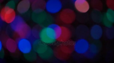 Parçacıklar hareket. Renkli, bulanık, bokeh ışıklar arka plan.